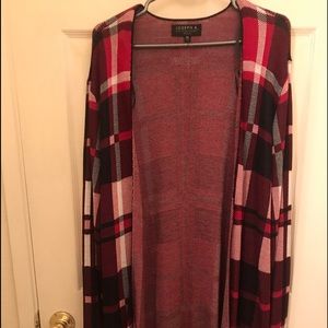 Red, black and white plaid cardigan. Size 1X. Never worn. Recently purchased